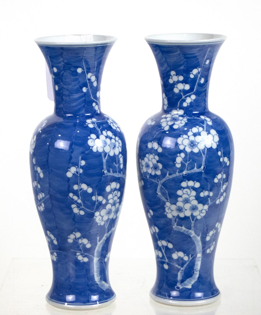 (lot of 2) Chinese blue and white prunus vases: (lot of 2) Chinese blue and white prunus vases. Bearing Kangxi four-character mark, 11.5" high.