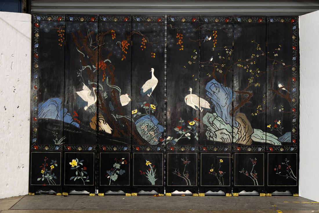 A Chinese black lacquer coromandel style eight-panel folding screen (1 of 3)
