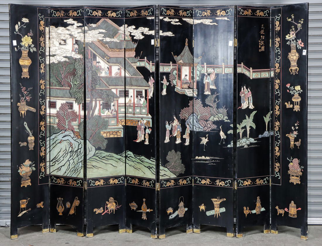 A Chinese eight-panel black lacquer coromandel figure and flower folding screen (1 of 2)