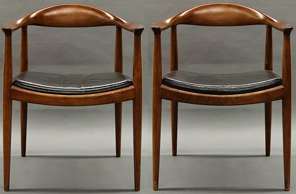 Pair of Hans Wegner/Johannes Hansen 'The Chair' arm cha: Pair of Hans Wegner/Johannes Hansen 'The Chair' arm chairs, designed 1949. Executed in solid teak with continuous arms and slightly splayed tapering legs. Having black leather seat cushion. Branded Jo