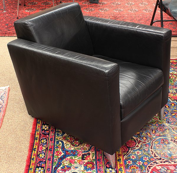 Pair of Len Niggelman leather and aluminum chairs: (lot of 2) Pair of Len Niggelman leather and aluminum chairs by Philippe Starck, circa 1986. Of square tub form with rounded aerodynamic cast aluminum front legs. This form was originally designed for