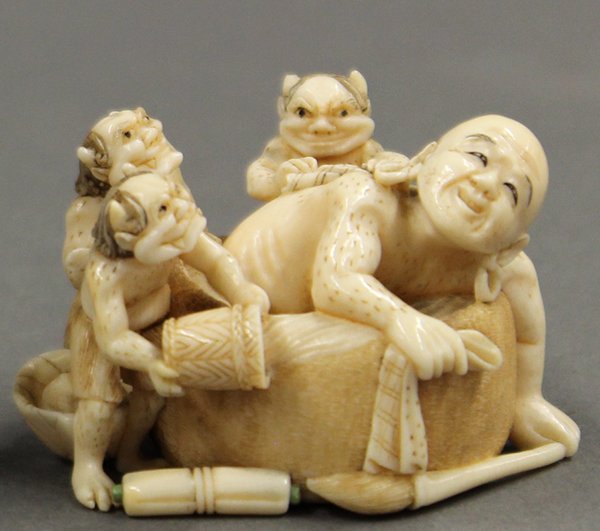 Japanese Ivory Netsuke, Oni: Japanese ivory netsuke, late 19th/early 20th century, of a rakan in a bath tub and three oni (Japanese demons) washing his back, portraying Buddhist teaching, that even devils can redeem themselves by