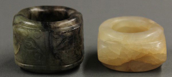 Chinese Carved Stone Cong: (lot of 2) Chinese small stone cong, the first, with a mottled tan colored matrix; the second, a jade cong of moss green and dark brown hues, the corners carved with taotie masks, 1.5"w