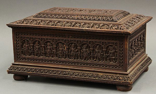 East Indian Carved Wooden Box: East Indian sandal wood export work box, the stepped lid and exterior of the box carved with various Hindu deities standing in arched doorways, the interior with an insert with multiple lidded compart