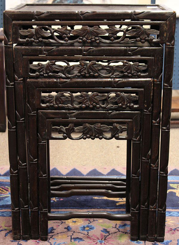 Chinese Wooden Nesting Tables: (lot of 4) Set of Chinese carved nesting tables, each with a faux bamboo form edge and legs, the apron pierced with grape vines, 28"h x 19.25"w x 13.75"w