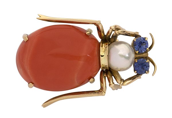 Yellow gold coral diamond blue sapphire beetle bug broo: Fourteen karat yellow gold beetle bug brooch having an oval cabochon cut coral body, a 7.0mm round cultured pearl head and blue sapphire eye accents, weighing in total approximately 0.33 ct.; 8.6 gram
