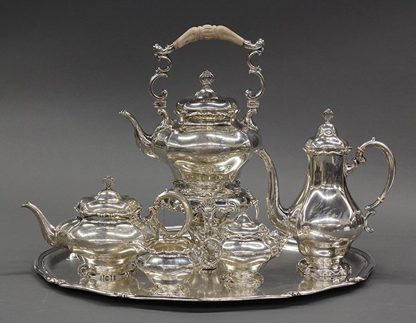 German .800 fine silver hot beverage suite: German .800 fine silver six piece hot beverage suite, by E. Marcus, consisting of hot water kettle on stand with warmer, coffee pot, teapot, covered sugar basin, cream pitcher, and tray, 161.82 troy o