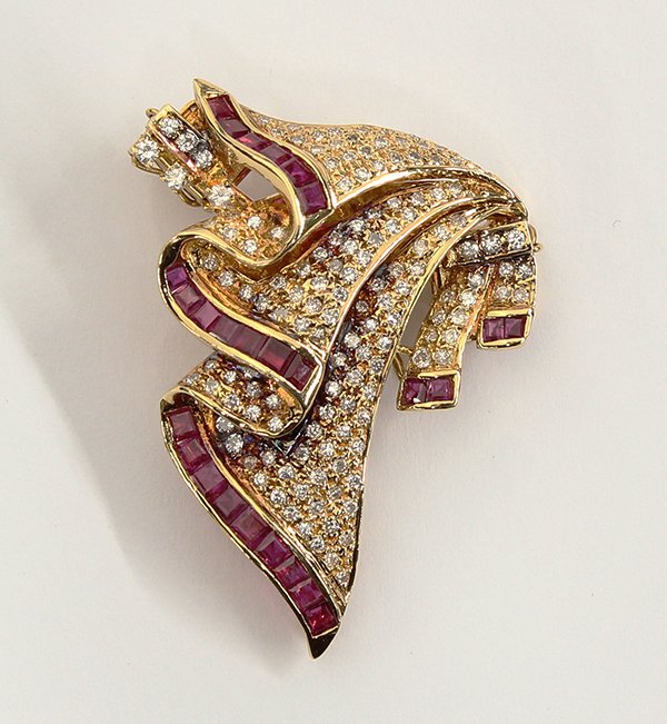 Eighteen karat yellow gold enhancer/clasp with rubies a