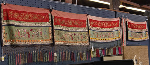 Group of Chinese Textile Hangings: (lot of 6) Chinese embroidered altar frontist pieces and tassels, consisting of two pairs of hangings, with one set featuring immortals in an imaginary landscape, together with a pair of tassels embro