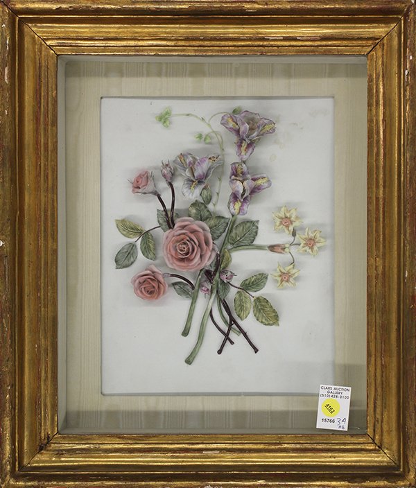 Continental style porcelain bouquet of flowers: Continental style porcelain bouquet of roses and irises mounted in a carved gilt shadow box frame, 19"h x 16.5"w x 4"d