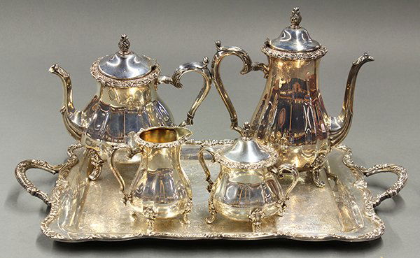 International Silver Company coffee and tea service: International Silver Company Countess silverplate coffee and tea service, 20th century. Fluted bodes with cast floral rims raised on stylized out swept feet. Marked. Set includes a coffee pot, tea pot
