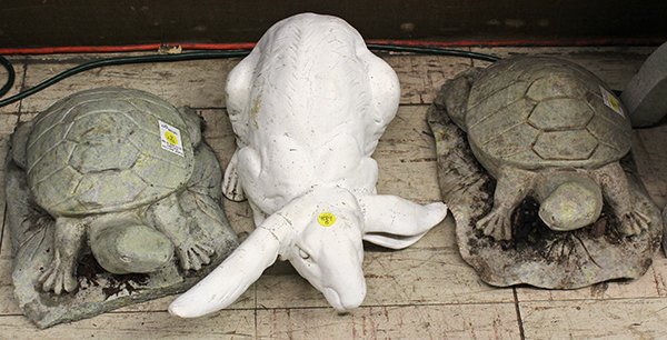 (lot of 3) Garden elements: (lot of 3) Garden elements, consisting of two stone carved turtles, each gazing outward and rising on a naturalistic base 6"h x 9"w, together with a figural rabbit, 5"h x 15"w