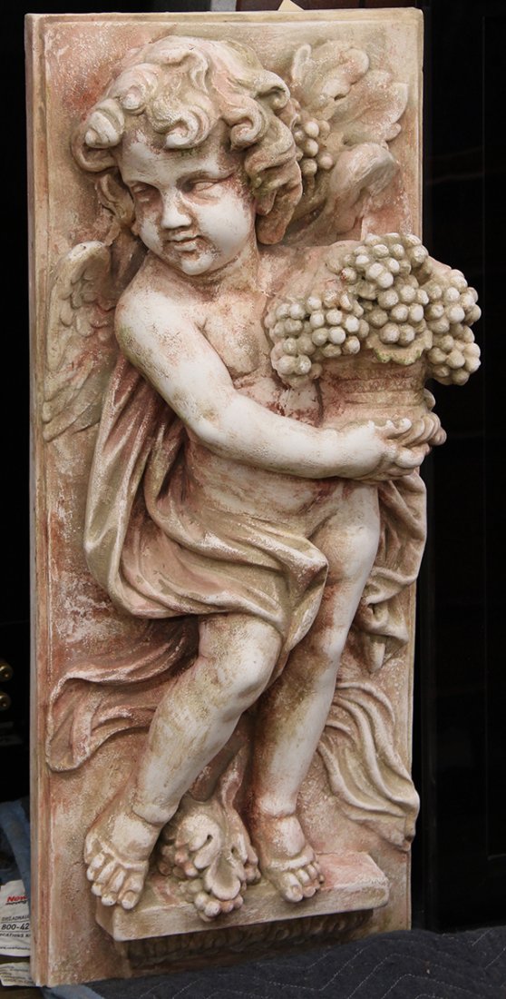(lot of 2) Relief decorarted plaster wall plaques: (lot of 2) Relief decorarted plaster wall plaques, each executed in the Classical taste depicting putti, on holding a basket of grapes, and depicting a harvest scene, each 29.5"h x 12.5"w