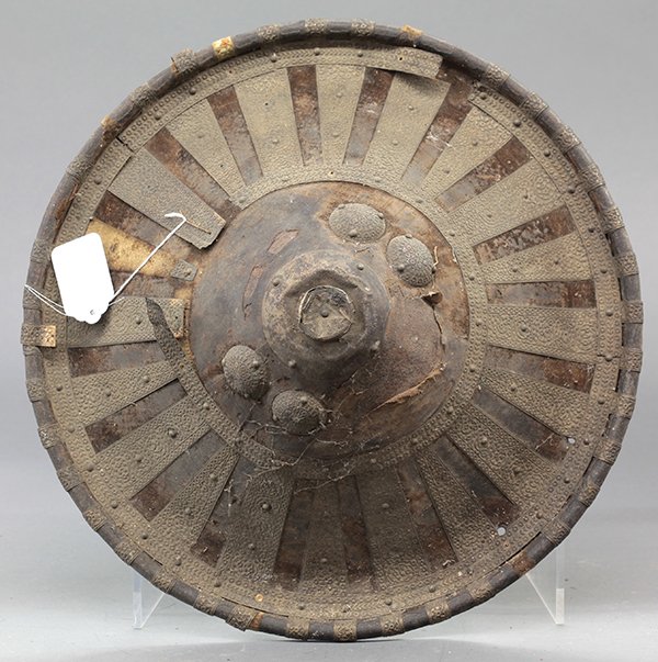 West African shield: West African shield, probably from the dry non-coastal area historically influenced by Islamic incursions, body of hardened hide with artful additions of thin metal stripes, old and much-used leather 