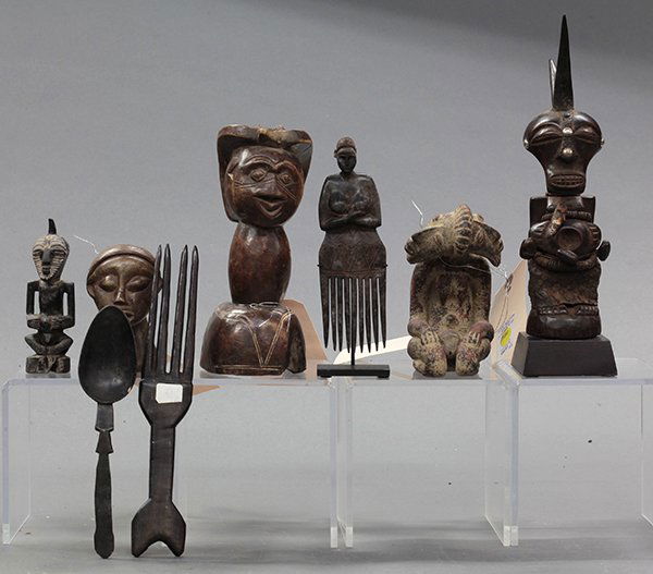 Associated group of African decorative art: (lot of 8) African decorative art consisting of busts, figures, one in the style of a figure of the Nok culture, inland Niger River Delta the other a magic figure aka fetish in the style of the Songye