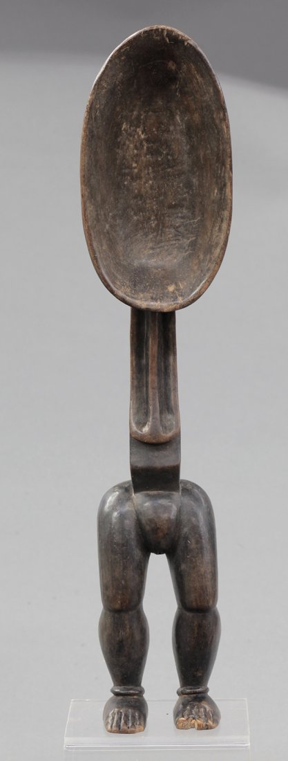 Dan complex of tribes, Cote d'Ivoire, female figural fe: Dan complex of tribes, Cote d'Ivoire, female figural feast ladle with a superbly carved hand on the back of the scoop and a hitherto-unseen chest treatment, age and ritual feast use uncertain, 22.5"h