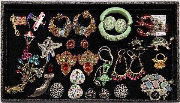 Costume jewelry lot with pieces by Kenneth J Lane and M: One tray of miscellaneous fashion jewelry items, some signed Kenneth J. Lane and Miriam Haskell including a stained glass necklace and earring set by M. Haskell; a heavily rhinestone encrusted pair of