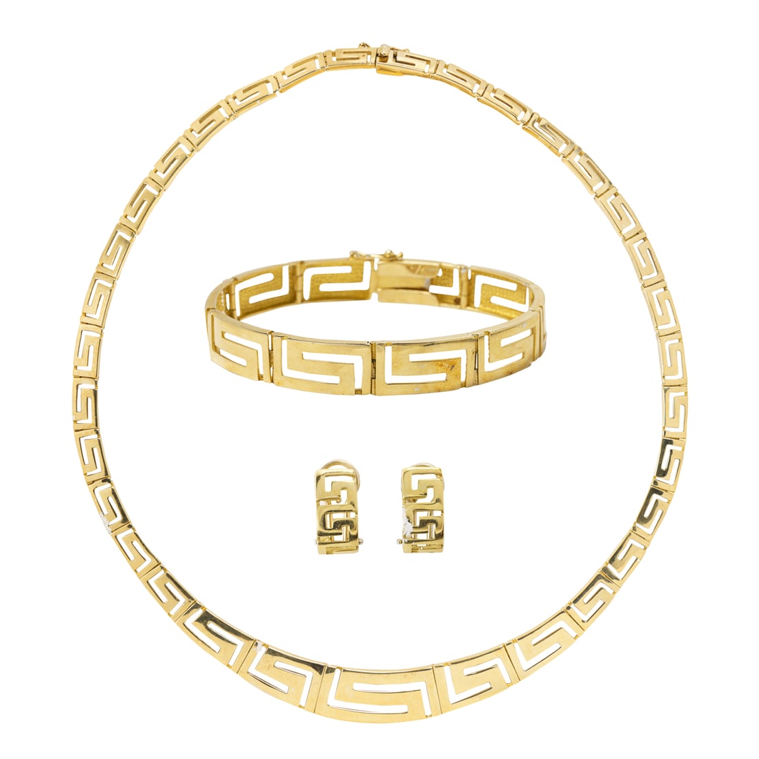 A 14k gold suite: A 14k gold suiteOf Greek key design, comprising a necklace, bracelet and pair of earrings; necklace length: 16 in; bracelet: 7 1/2 in; earring: 5/8 in; gross weight: 56.30 grams