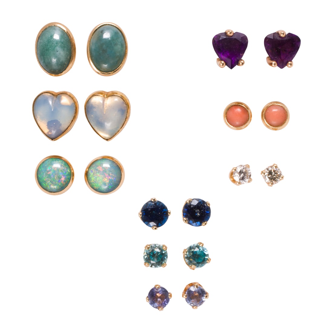 A collection of gemstone and 14k gold stud earrings: A collection of gemstone and 14k gold stud earringsComprising nine pairs of stud earrings, including amethyst, coral, sapphire, diamond, hardstone and opal; gross weight: 8.40 grams