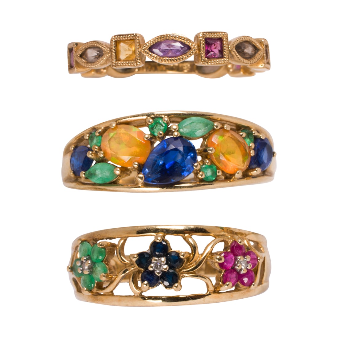 Three multi-gem, 10k, and 14k gold rings (1 of 2)