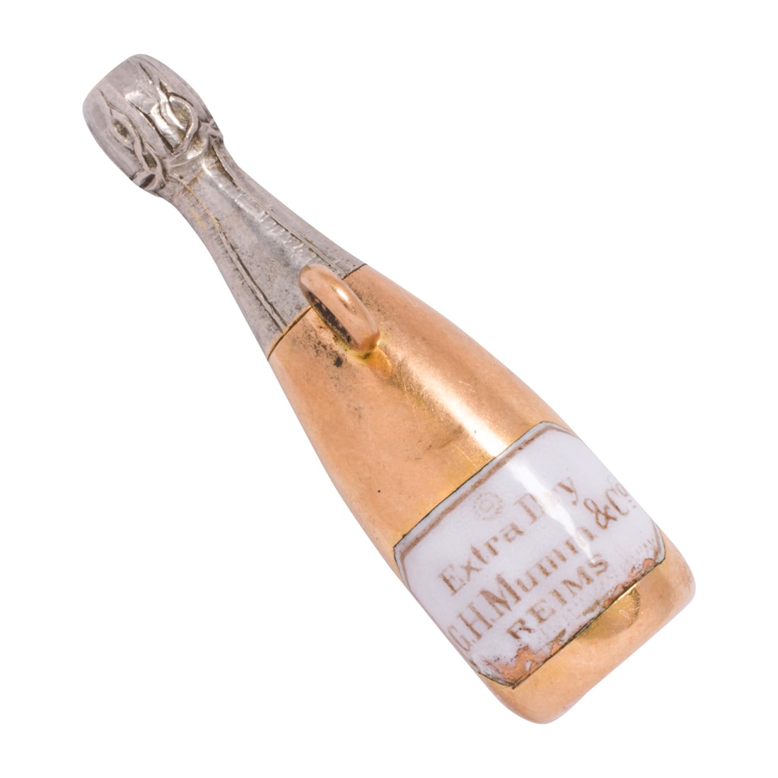 An antique enamel and 15k bi-color gold champagne bottle taxi whistle: An antique enamel and 15k bi-color gold champagne bottle taxi whistleDesigned as a champagne bottle with enamel label; length: 1 1/2 in; 5.85 grams