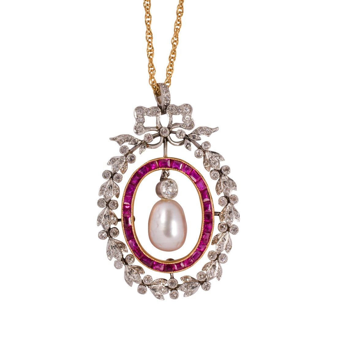 An antique diamond, ruby, cultured pearl, platinum, and 14k gold pendant necklace: An antique diamond, ruby, cultured pearl, platinum, and 14k gold pendant necklacethe pendant featuring a platinum garland set with 83 old mine-cut diamonds, an inner gold frame set with 26 square-cut