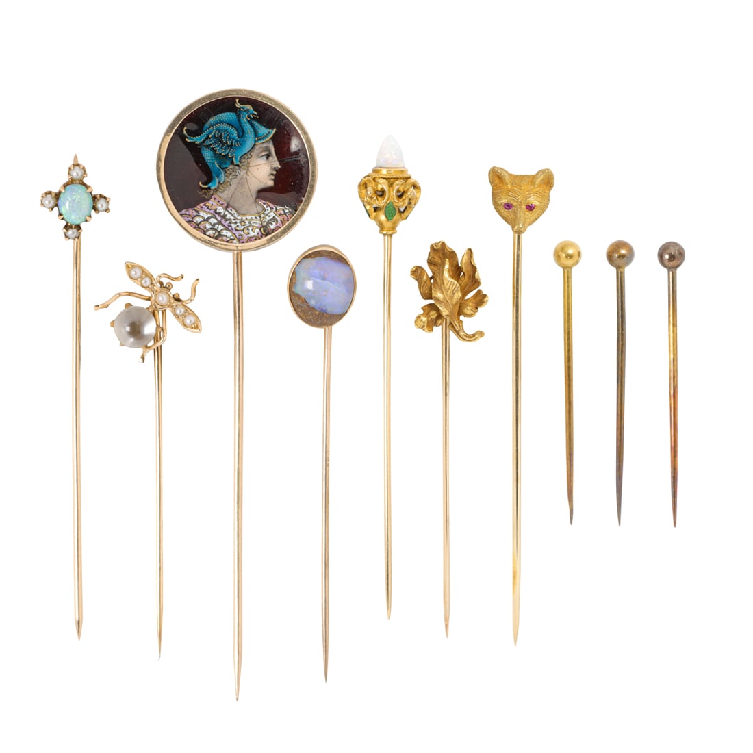 A group of antique gem-set and gold stick pins: A group of antique gem-set and gold stick pinsten stickpins of 14k and 10k gold, including opal, moonstone, seed pearl, ruby and enamel; gross weight 14.69 grams
