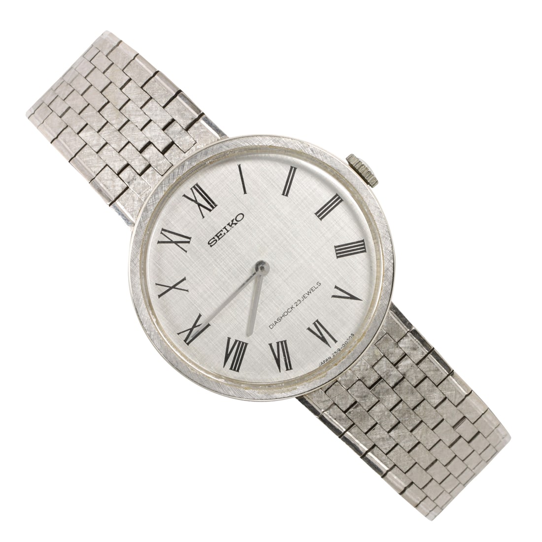 A Seiko Diashock 14k white gold watch: A Seiko Diashock 14k white gold watchCase no.: 2519-0170Serial no.: 6N02206The silver-tone face, black Roman indices, silver-tone stick hands, within florentine finish 14k white gold case, containing