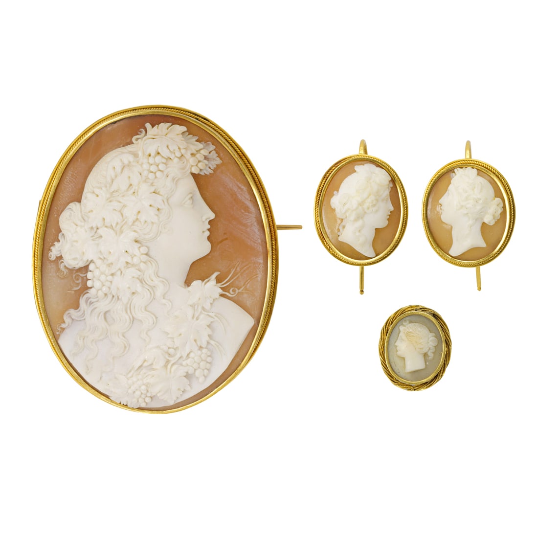 A group of shell cameo and gold jewelry: A group of shell cameo and gold jewelryComprising a shell cameo brooch and pair of earrings set in 18k gold, and a gold and metal cameo element; brooch length: 2 1/4 in; earring length: 1 in; pendant