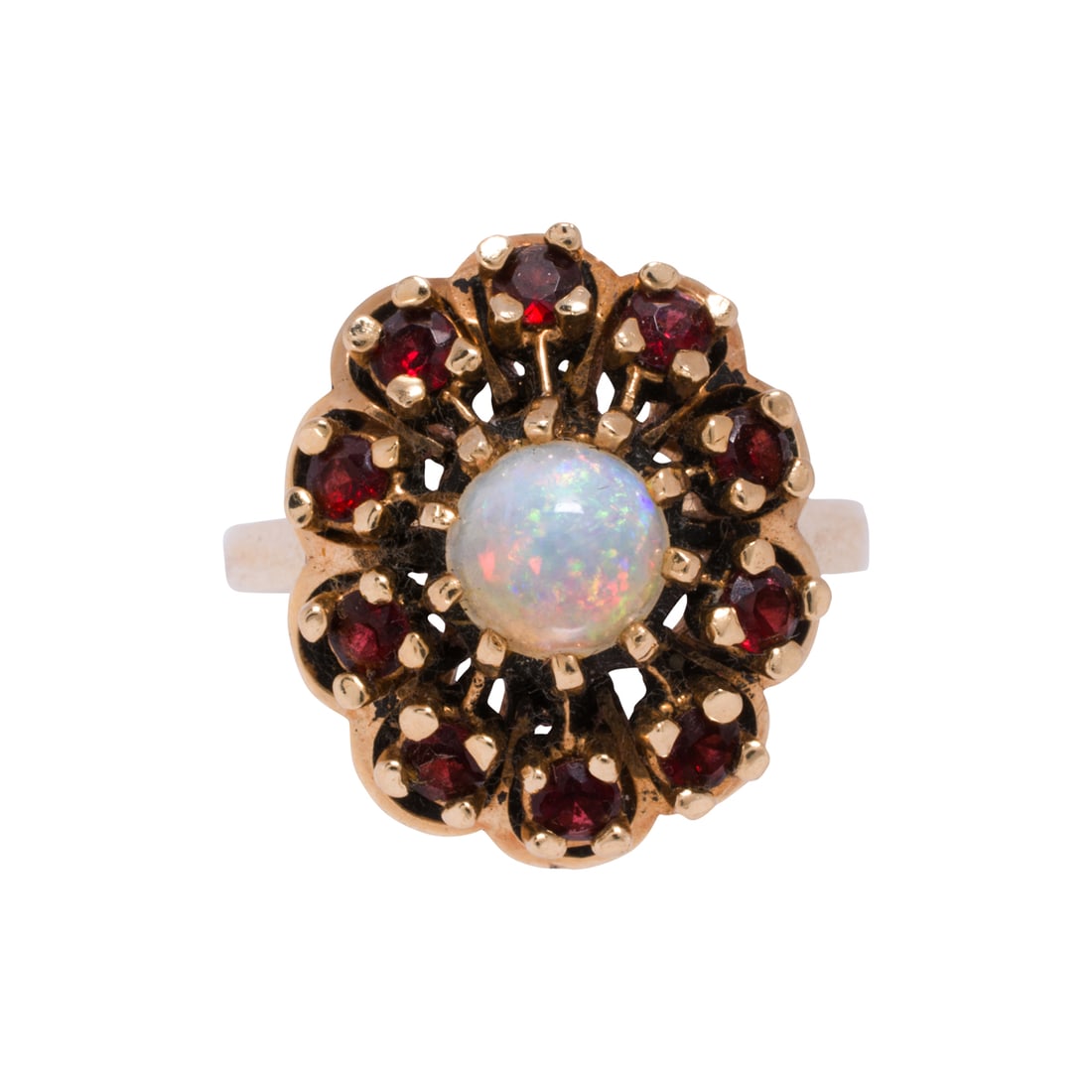 An opal, garnet, and 14k gold ring: An opal, garnet, and 14k gold ringCentering a round-shaped opal cabochon measuring 6.41 mm across, framed by 10 round-cut garnets measuring 2.63 mm; size 7 1/2; 7.95 grams