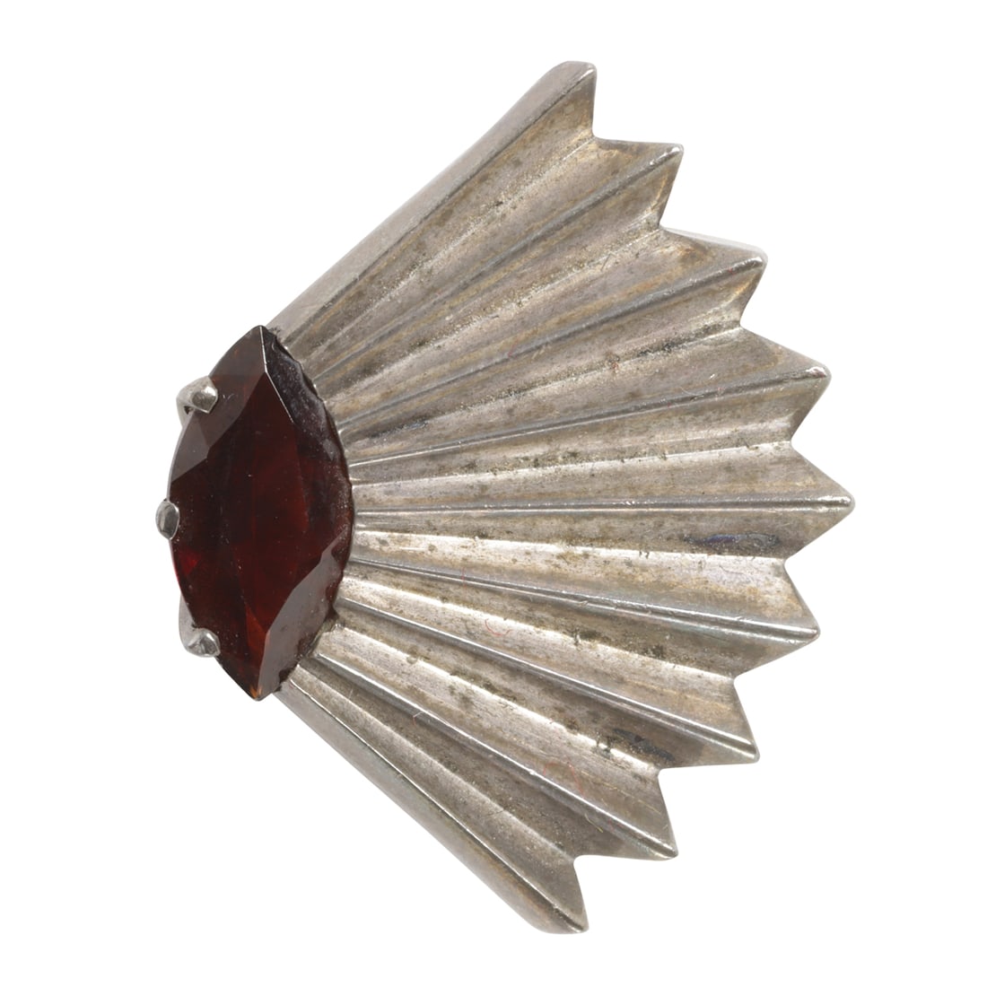 An Erte garnet and sterling silver ring: An Erte garnet and sterling silver ringof fan design, featuring a marquise-cut garnet; size 6 1/4; 8.69 grams