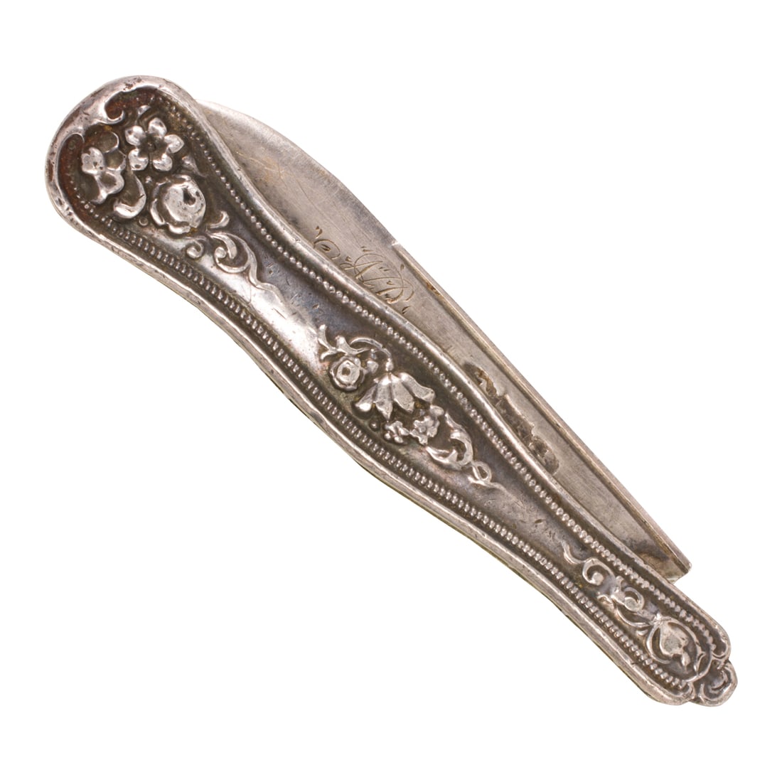 A Tifft & Whiting Victorian silver folding pocket knife: A Tifft & Whiting Victorian silver folding pocket knifeFeaturing embossed floral accents; length (extended): 4 7/8 in; 23.30 grams