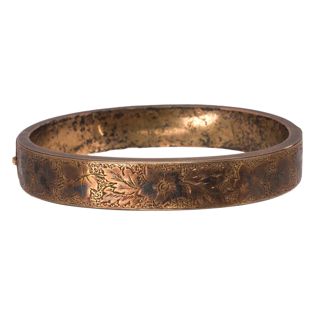 A Victorian silver bangle bracelet: A Victorian silver bangle braceletDesigned as a hollow-form bangle accented by ornate floral etching; inner circumference: 6 in; 13.80 grams