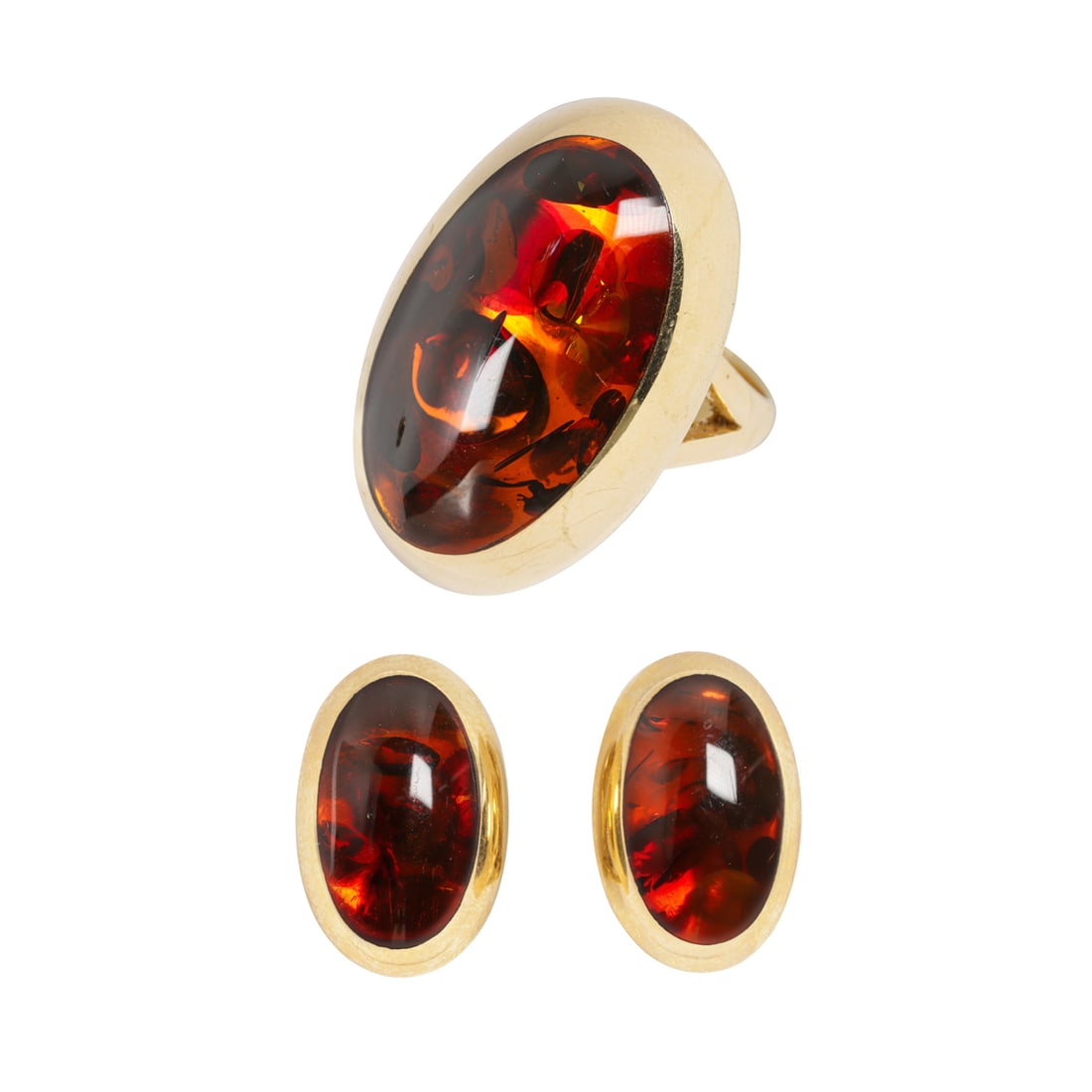 A Willy Jagert for Halberstadt amber and 14k gold ring and earring set, Denmark: A Willy Jagert for Halberstadt amber and 14k gold ring and earring set, DenmarkEach piece featuring an oval-shaped amber cabochon; ring size: 7, earring length: 3.4 in; gross weight: 17.80 grams