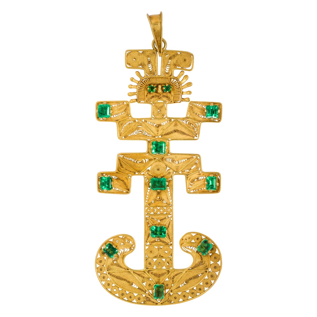 An emerald and 18k gold pre-Colombian replica pendant: An emerald and 18k gold pre-Colombian replica pendantThe replica referencing a pre-Colombian shamanic pendant constructed from intricate filigree, accented by ten emerald-cut emeralds and round-cut