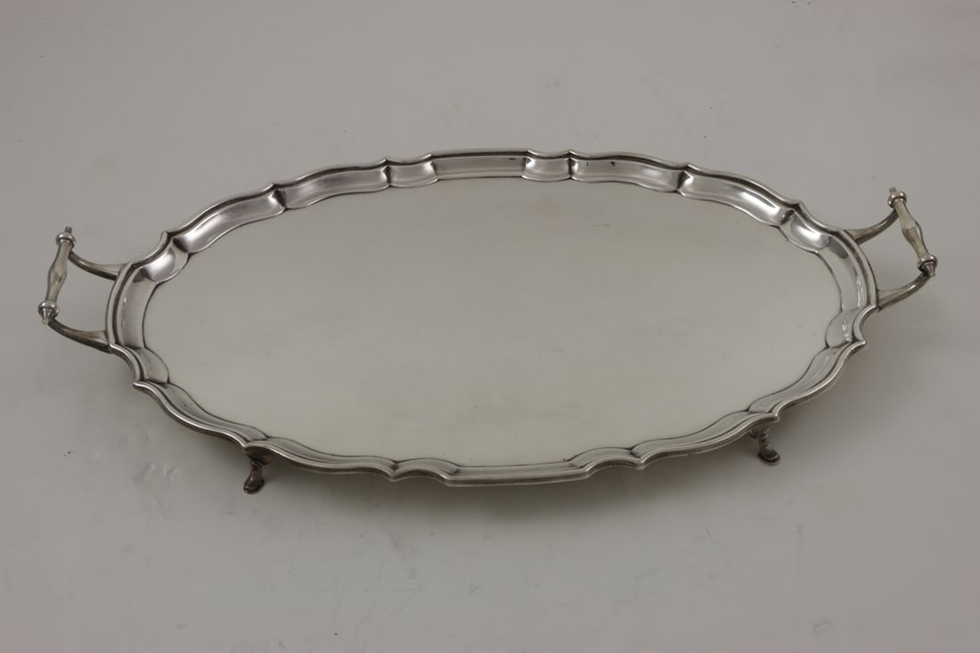 An English Barker Bros, Chester, 1913 Sterling Tray: An English Barker Bros, Chester footed sterling tray, 1913, 20"l including handles. 53.40 troy oz.
