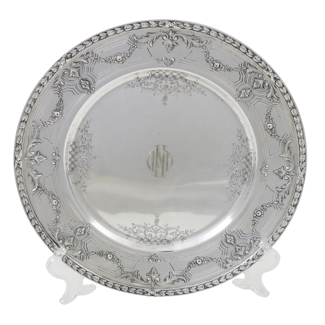 A Black, Starr Frost Exclusive Design Sterling Tray: An American Black, Starr Frost exclusive design sterling tray, floral swag border centering a monogram 'ANA'. 11.25"dia. 23.60 troy oz