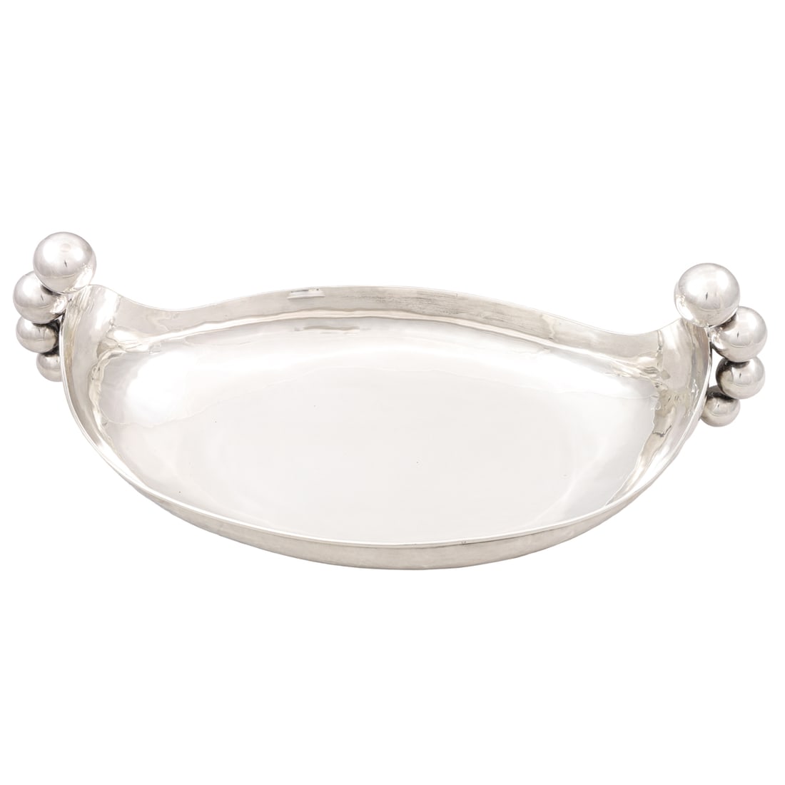 A Mexican sterling footed bowl Zunita (Plateria Zunita): A Mexican sterling footed bowl, Zunita (Plateria Zunita), with ball form handles, 8.5"h x 20.75"l x 10.5"d, 48.85 troy oz