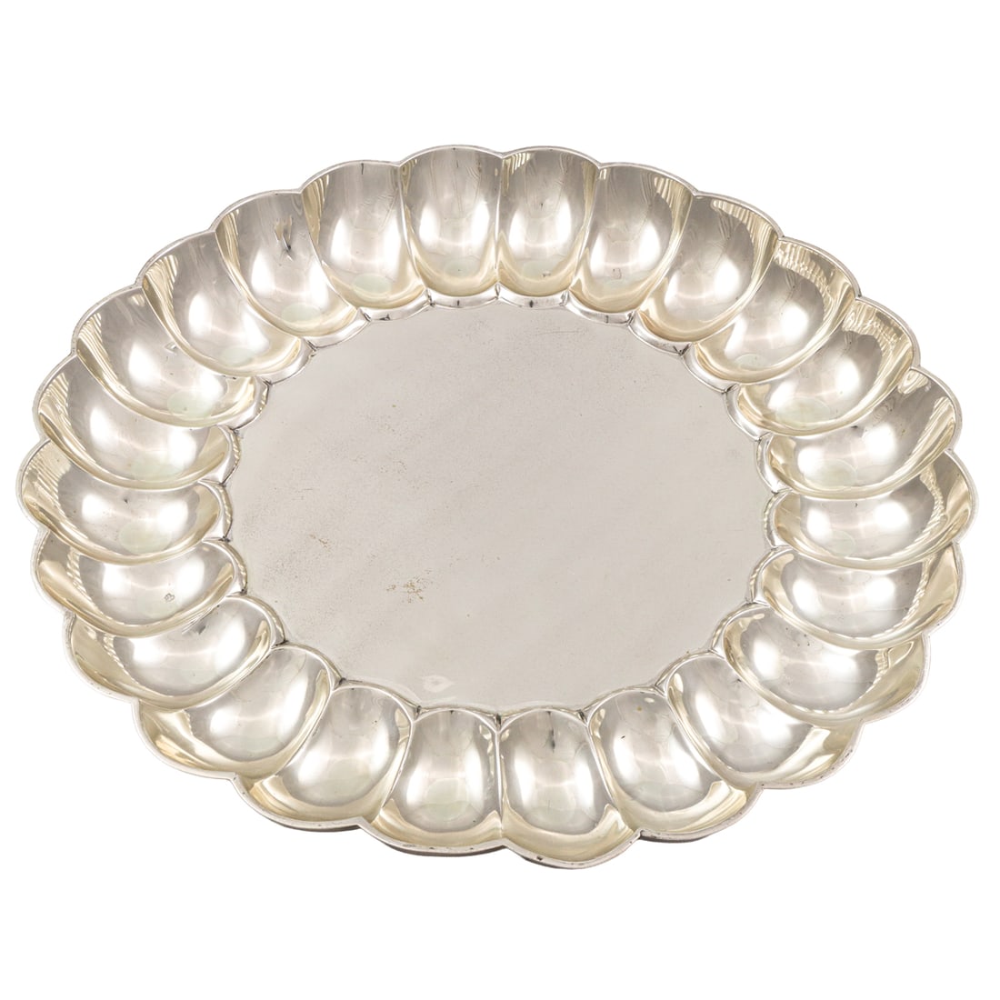 A Mexican sterling platter Alfredo Ortega and Sons: A Mexican sterling platter, Alfredo Ortega & Sons, featuring a scalloped border, 2"h x 18.25"dia. 70.81 troy oz.