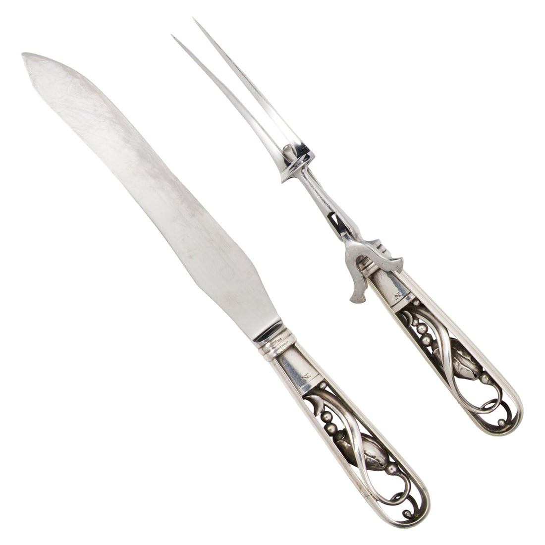 A Danish Georg Jensen Blossom Pattern Sterling Carving Set: A Georg Jensen Blossom pattern sterling carving set, comprising (1) carving fork, 10.5"l; (1) carving knife, 12.5"l [2 total]