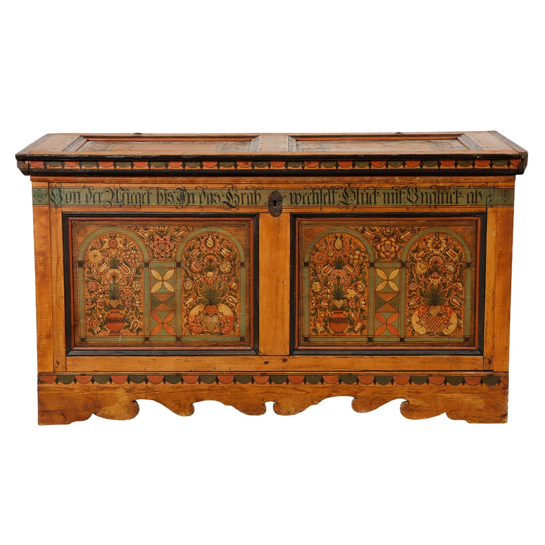 A German paint decorated chest circa 1800: A German paint decorated chest circa 1800, the paneled case with floral fronts surmounted by the script border, the sides with winged eagle reserves, retains original hardware, 34"h x 61"w x 26.5"