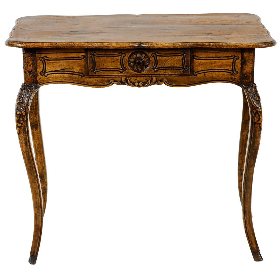 A Rococo style writing desk: A Rococo style writing desk, the oak form with a single drawer with geometric incising, and rising on shaped legs, 27.5"h x 31"w x 20"d
