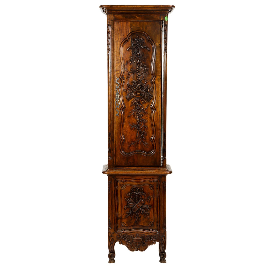 A French Louis XV Provincial tall case clock third quarter 18th century: A French Louis XV Provincial tall case clock third quarter 18th century, the carved panelled case with ribbon and vine reserves continuing to the front of case, with weights, movement, and pendulum,