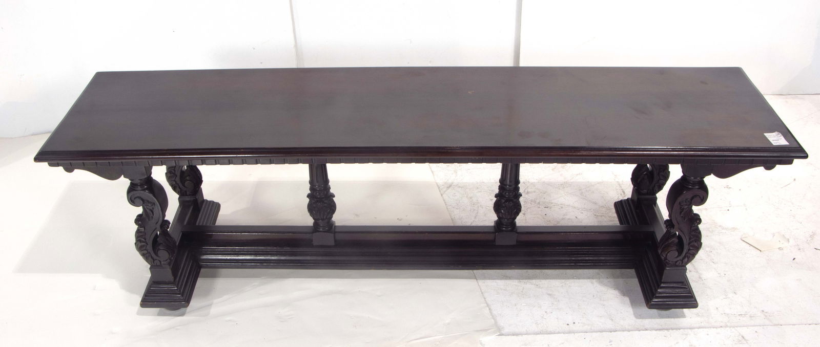 A Spanish Revival library table with bench: A Spanish Revival library table with bench, executed in mahogany with carved lyre form supports resting on the graduated lower tier, bench 30"h x 65"w x 23.5"d, table 18.25"h x 60"w x 14.75"d