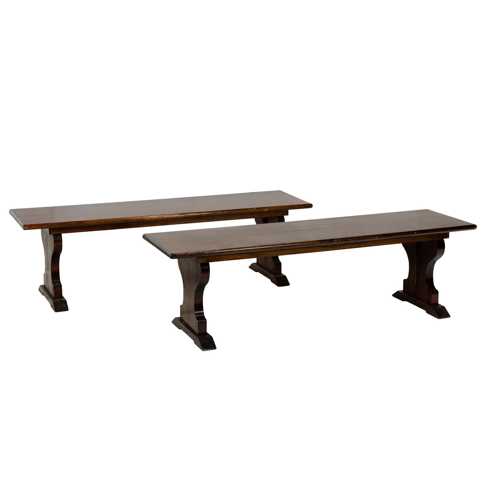 A pair of Arts and Crafts benches commissioned for Santa Sabina Center 1930's: A pair of Arts and Crafts benches commissioned for Santa Sabina Center 1930's, each consisting of a rectangular top and rising on shield form trestle supports, 17"h x 59"w x 16"d, Provenance: