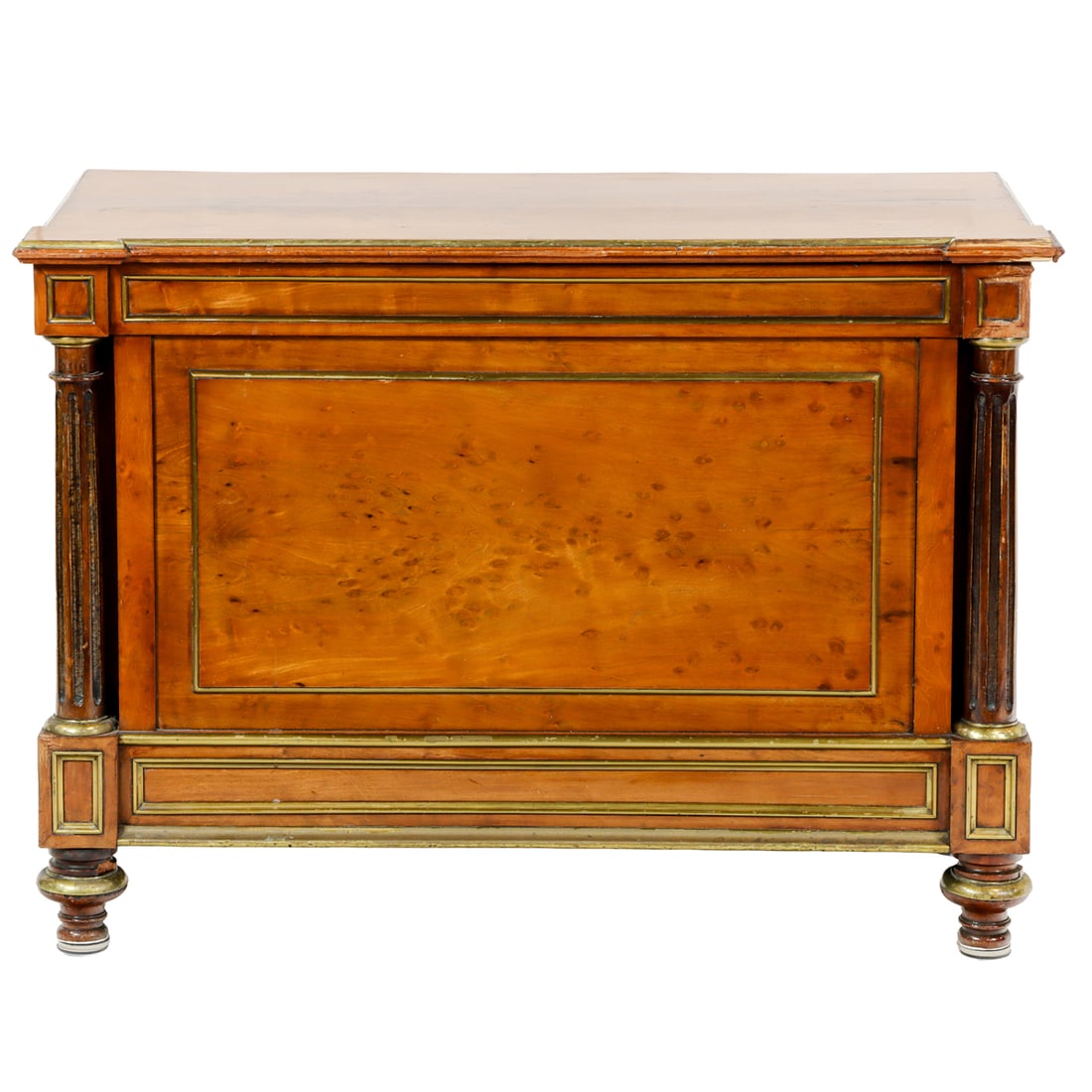 An Empire style hinged cabinet: An Empire style hinged cabinet, the brass mounted case with raised panels and fluted pilasters surmounted by the hinged top, and rising on turned feet, 39.5"h x 20"w x 19.5"d