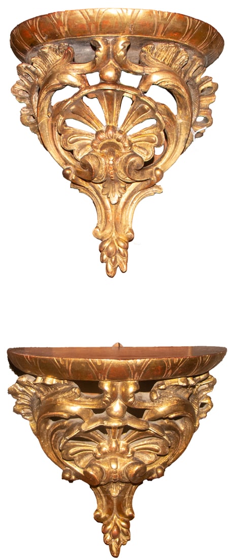 A pair of Rococo style giltwood and gesso wall brackets: A pair of Rococo style giltwood and gesso wall brackets, 19th century, each round top supported on pierced scrollwork and shell, 12.5"h x 11"w x 8"d