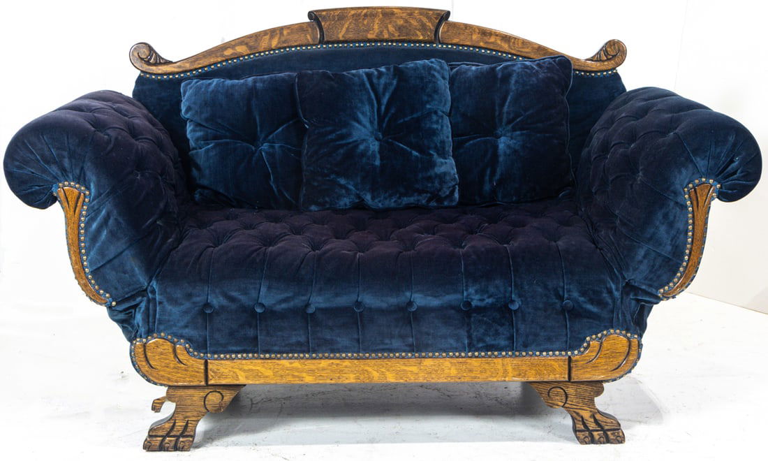 A late Victorian oak settee