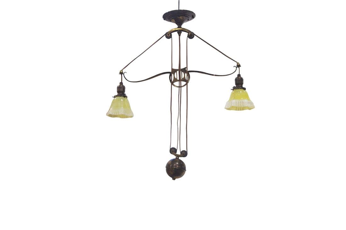 A "Rise and Fall" Art Nouveau Fixture with two shades: An Art Nouveau 'Rise & Fall' two-light fixture, circa 1910, the brass telescopic pendant fixture featuring a weighted counter-balance mechanism and two opalescent swirl glass shades with ruffled rims,