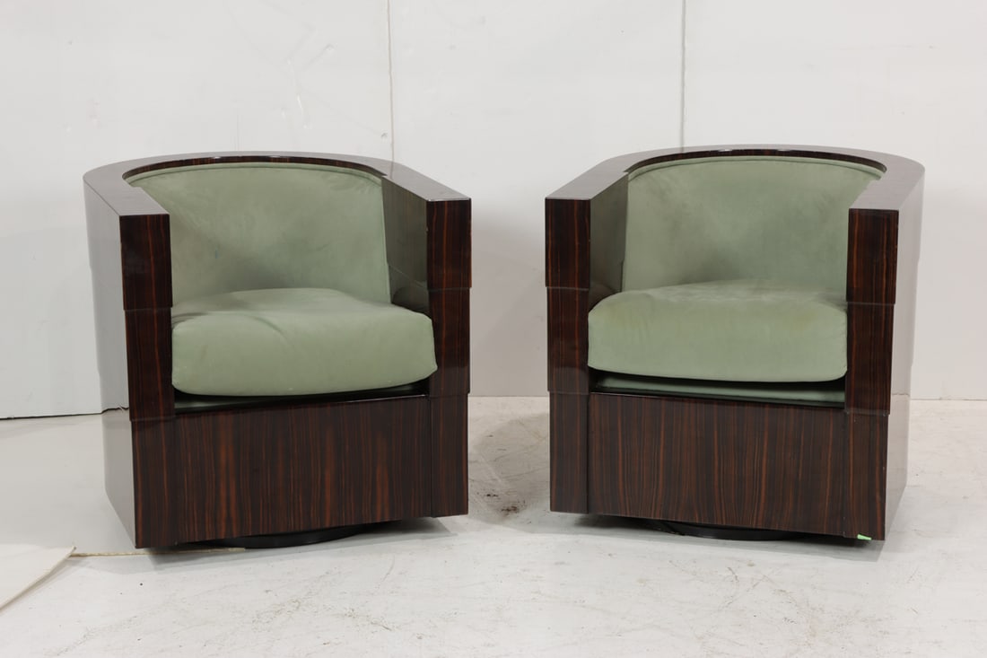 A pair of Pace macassar ebony club swivel lounge chairs: A pair of Pace macassar ebony club swivel lounge chairs, 28"x"h x 27"w x 24"d (seat)